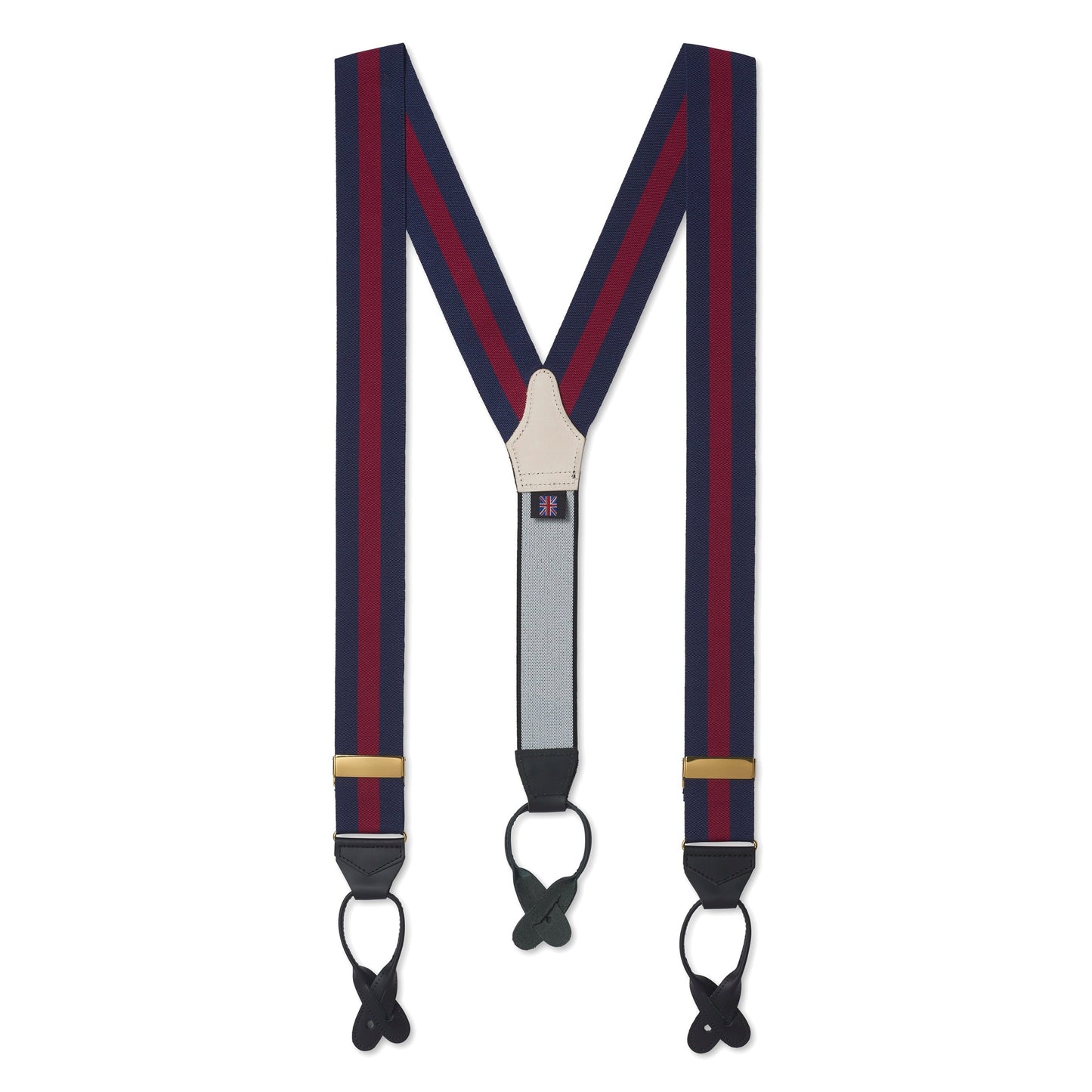 Black leather braces with brass buckles worn on a man's legs by Benson & Clegg.