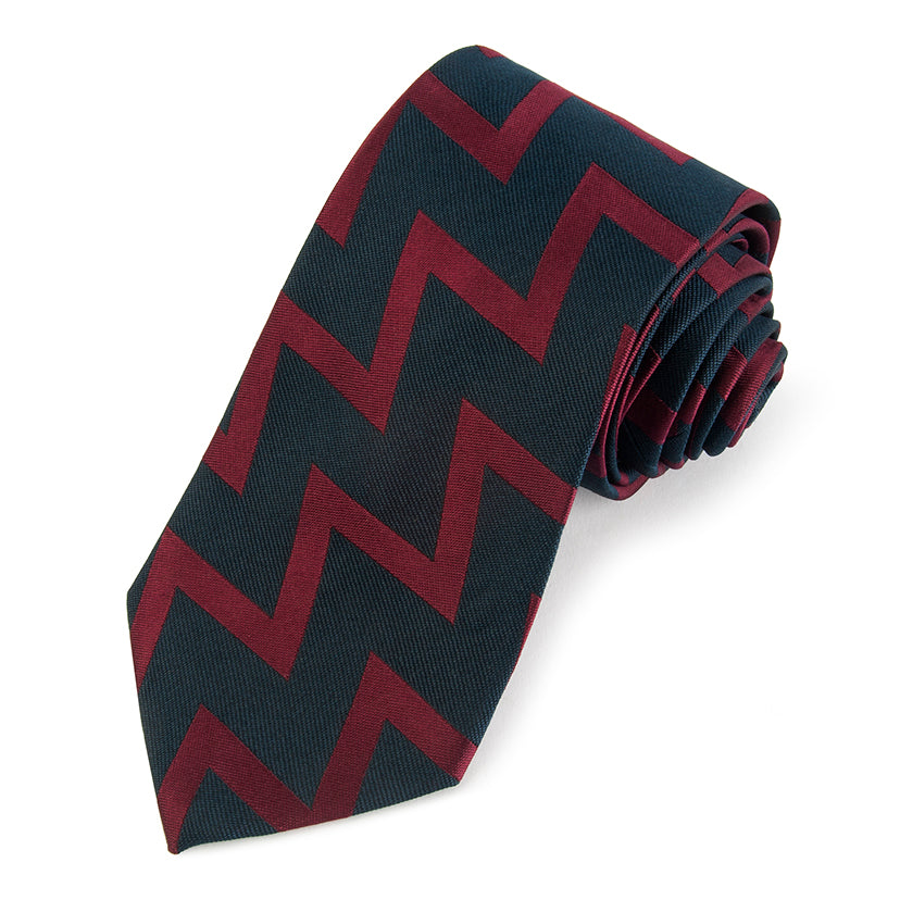 Royal Artillery Three-Fold Silk Tie in deep navy blue with gold trim, displayed flat on a white background, by Benson & Clegg