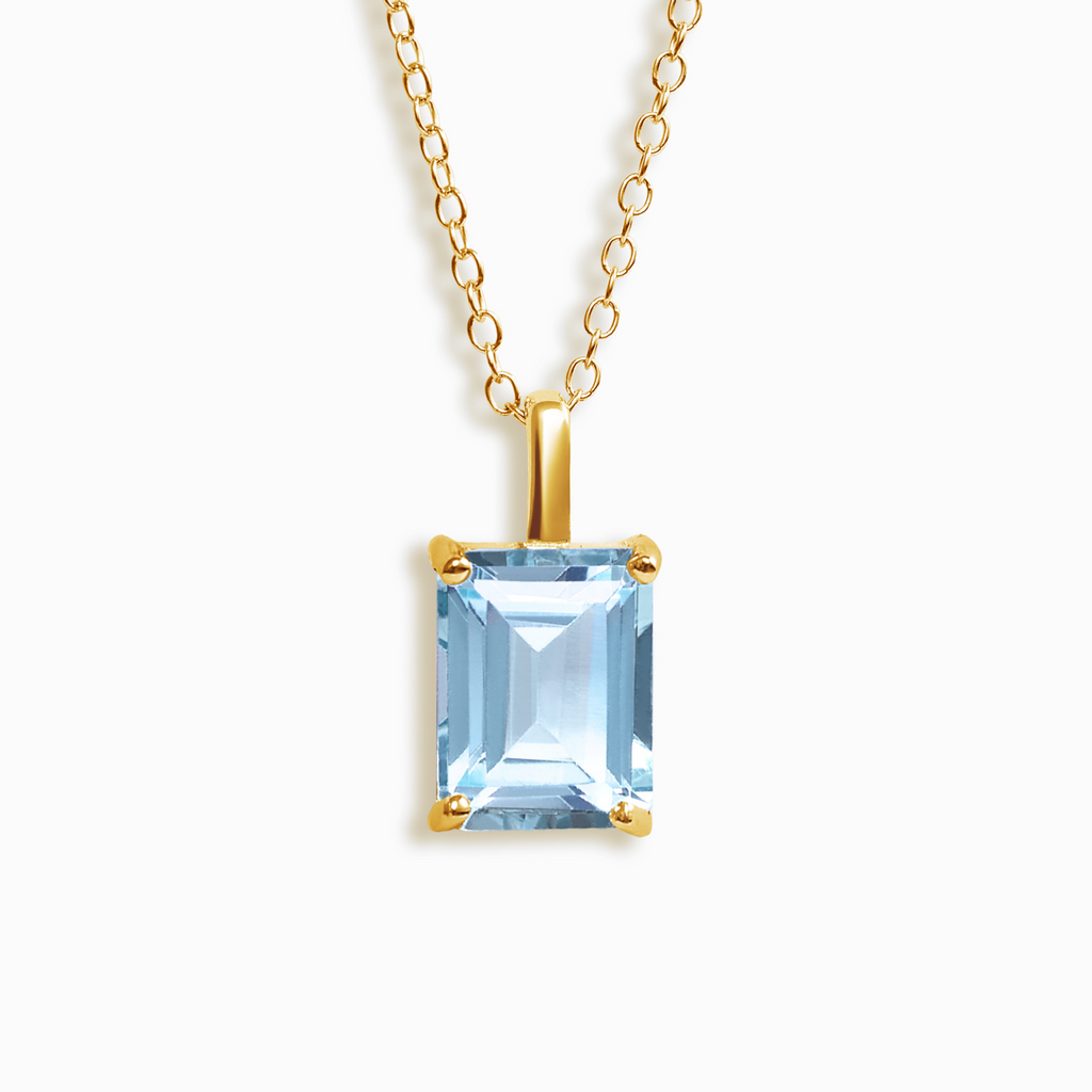 Pendentif en topaze bleue taille émeraude en vermeil d'or 18 carats