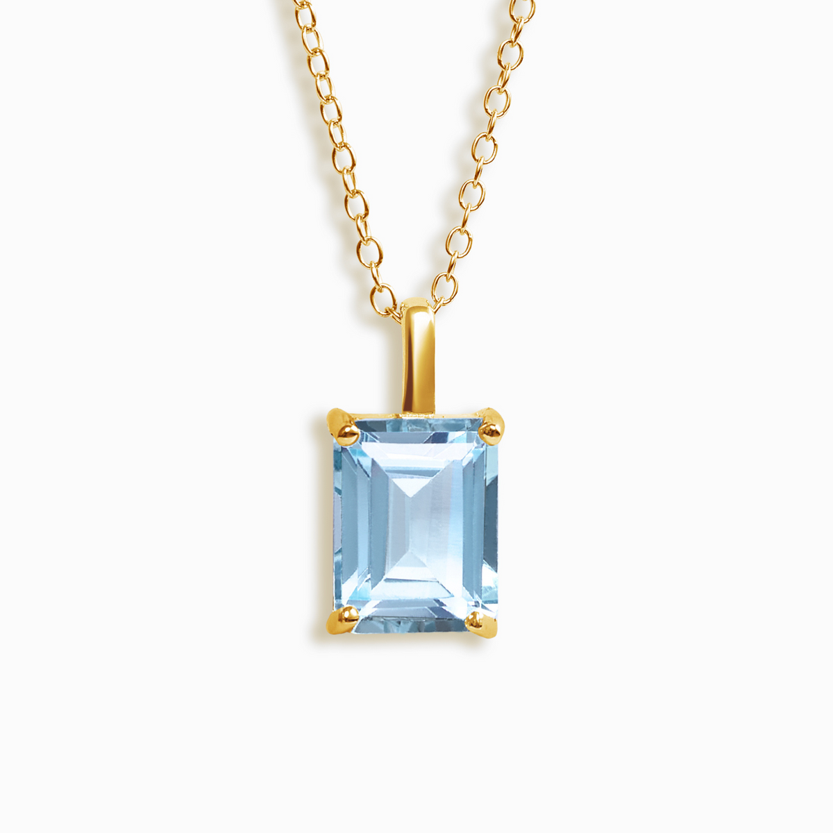 Pendentif en topaze bleue taille émeraude en vermeil d'or 18 carats