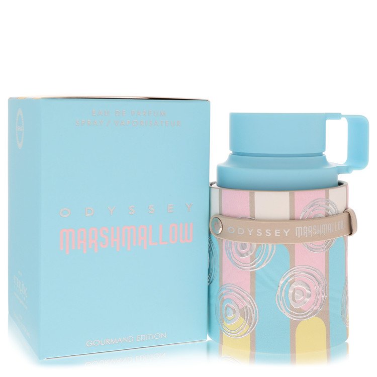 A clear glass perfume bottle with a pink label and gold accents, standing on a white surface, labeled "Armaf Odyssey Marshmal