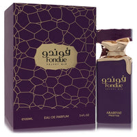 A vertical velvet bottle of Arabiyat Prestige Fondue Velvet Dip Eau de Parfum Spray in gold accents for women by The Fragranc
