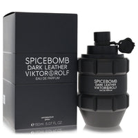Dark leather fragrance bottle with gold accents, standing on a white surface, labeled Viktor & Rolf Spicebomb Dark Leather Ea