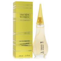 A clear glass bottle with a gold cap and pink label, featuring the fragrance name "Trendy Woman" on a white background, by Th