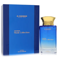 A dark glass bottle of Al Haramain Musk Collection Eau De Parfum Spray 3.3 oz / 100 ml for Men with a minimalist label by The