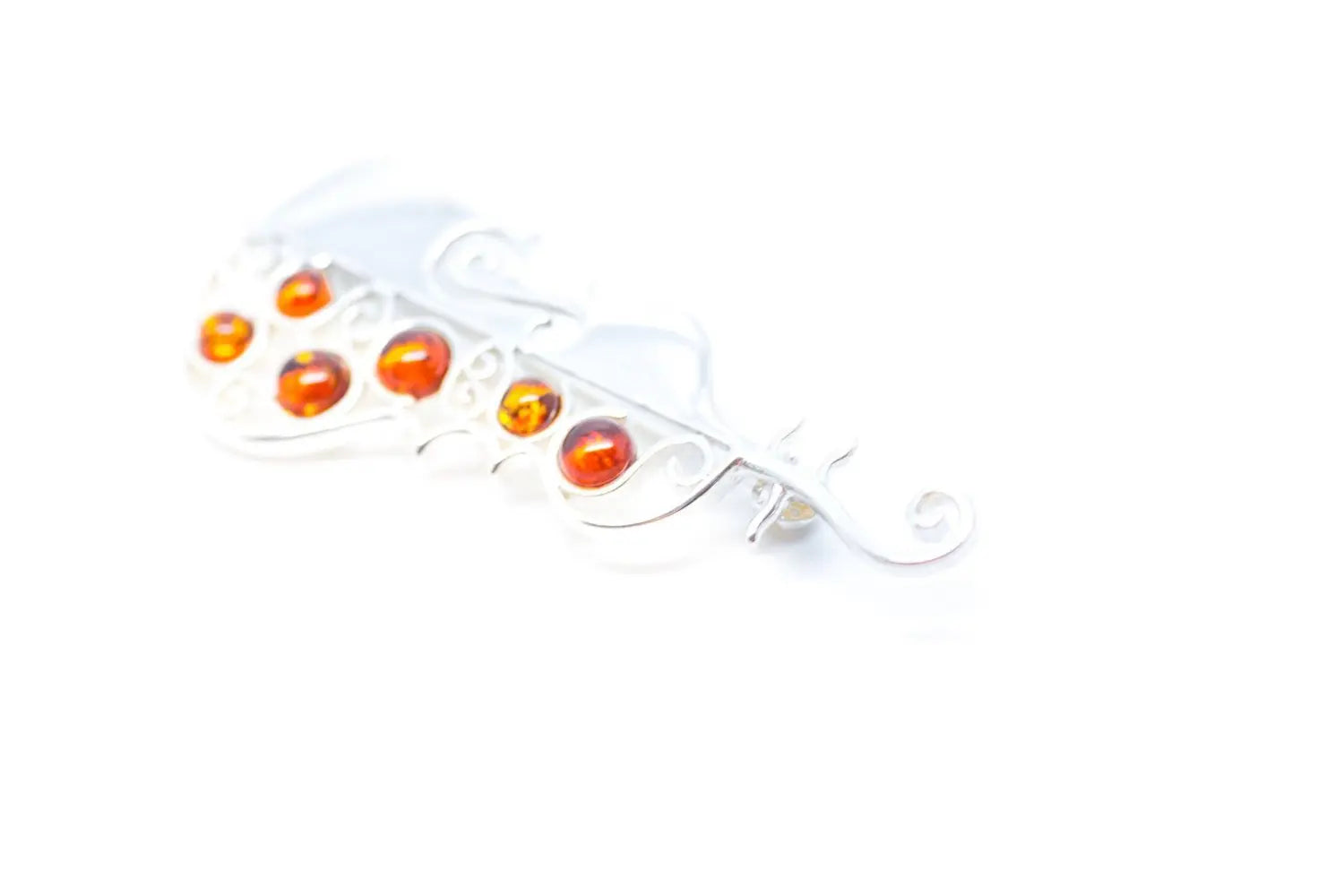 Broche de violoncelle en ambre