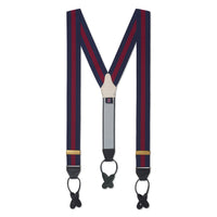 Black leather braces with brass buckles worn on a man's legs by Benson & Clegg.