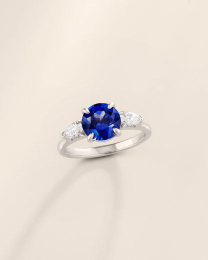 Blue Sapphire Round Cut Three Stone Engagement Ring in Sterling Silver - SJR London Timepiece