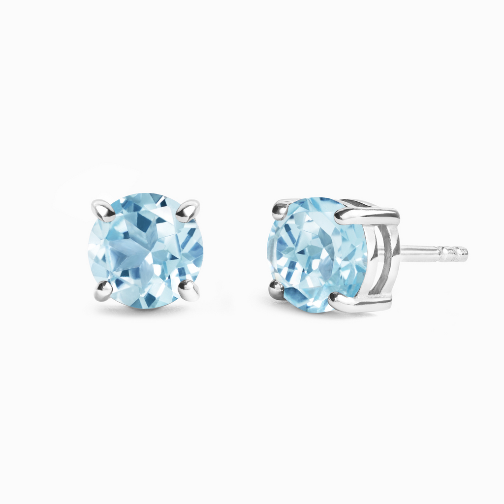 Puces d'oreilles rondes en topaze bleue de 6 mm en argent sterling