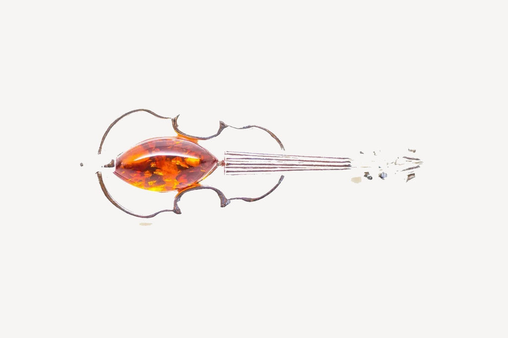 Broche en ambre classique en forme de violon