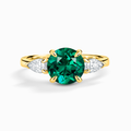 Bague de fiançailles trilogie émeraude taille ronde en vermeil d'or 18 carats