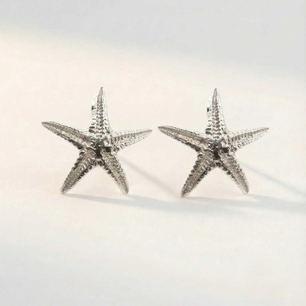 Puces d'oreilles étoiles de mer délicates en argent