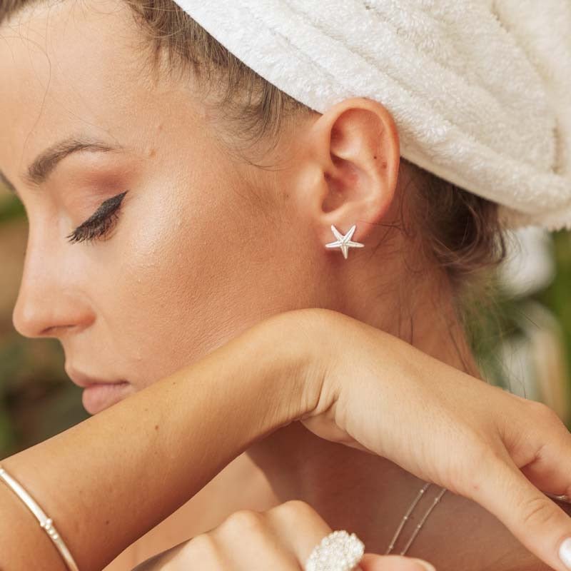Puces d'oreilles étoiles de mer délicates en argent