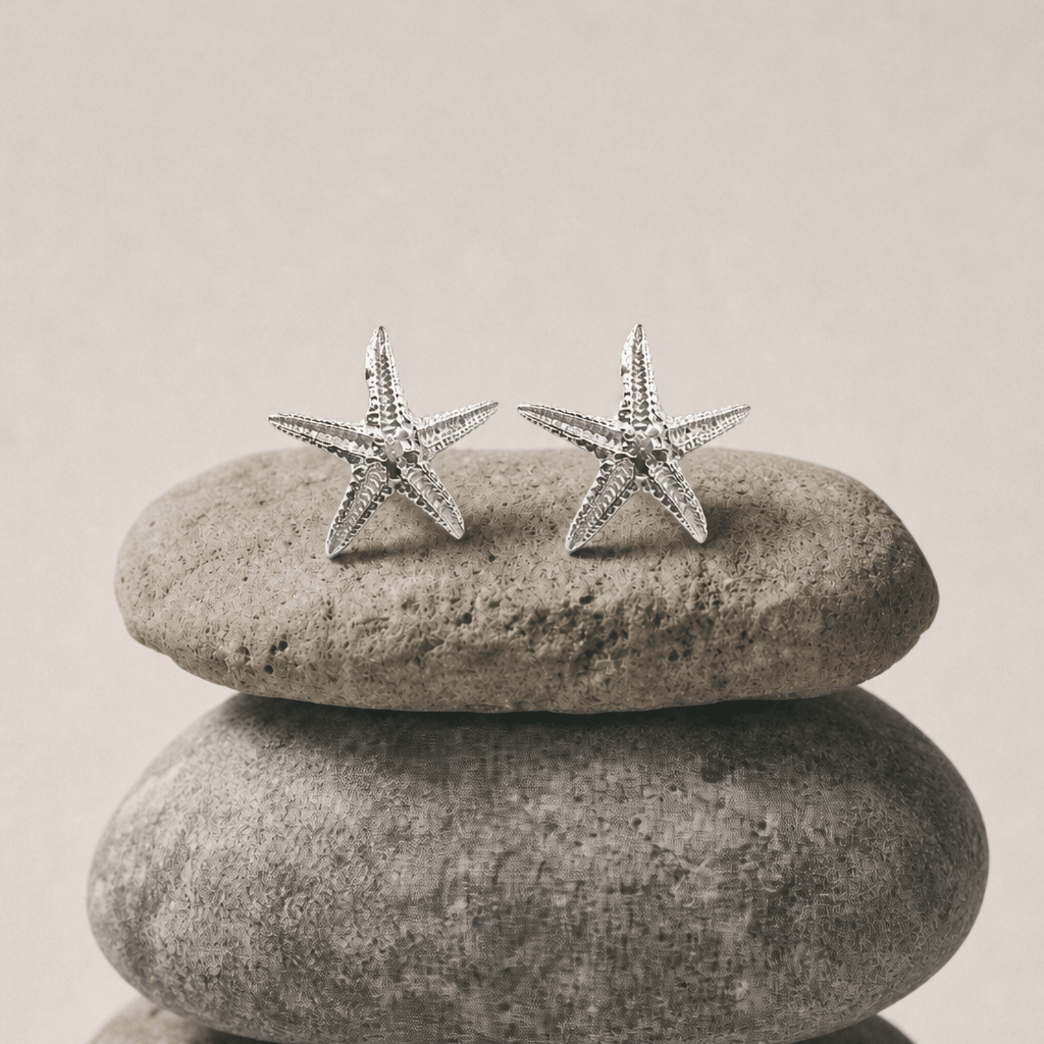 Puces d'oreilles étoiles de mer délicates en argent