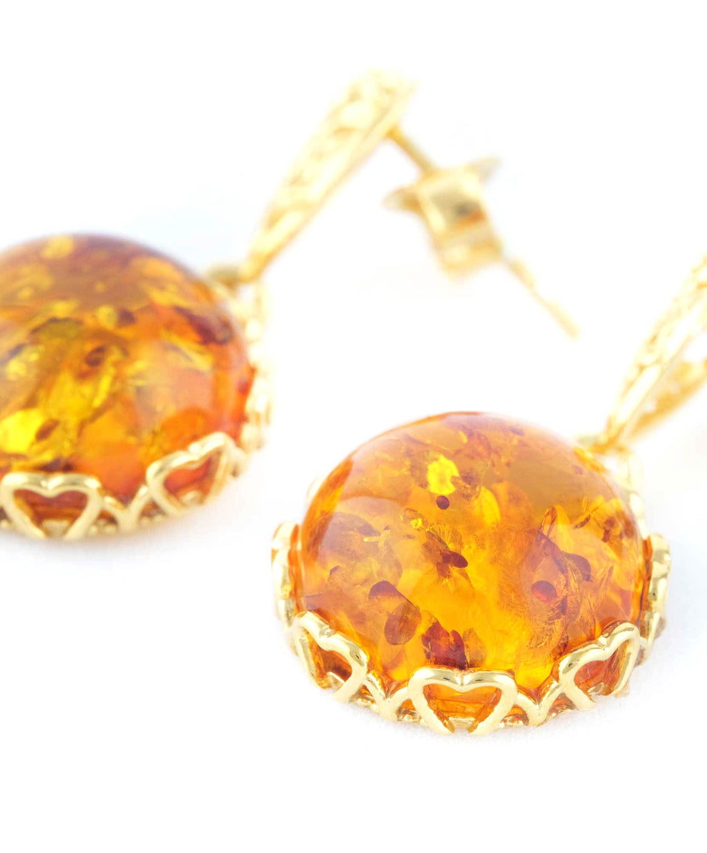 Boucles d'oreilles pendantes en ambre avec accent floral doré