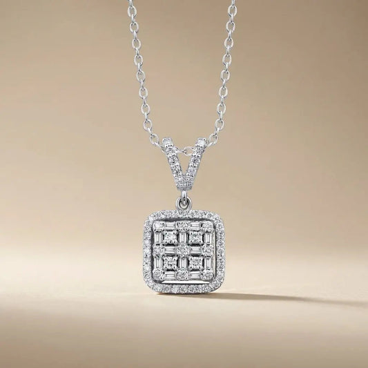 A square cluster of natural diamonds set in 14k white gold pendant worn on a chain by Majestic Jewellery.
