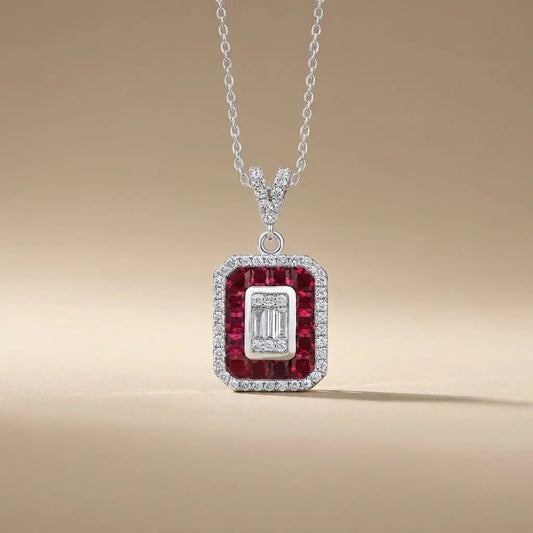 14ct white gold ruby and diamond pendant with a ruby halo and baguette diamond 0.31ct by Majestic Jewellery