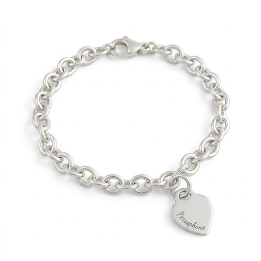 A silver heart tag charm bracelet with personalized engraving by Scarlett Jewellery